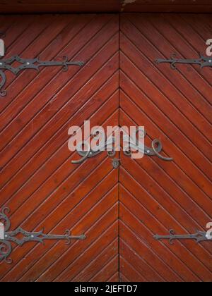 Ancient wooden door with iron curtains Stock Photo