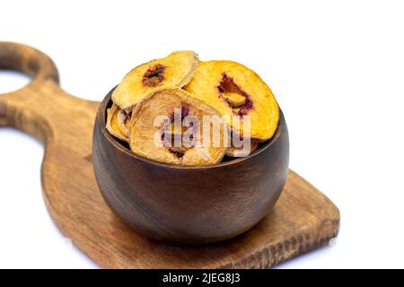 Dried peach slices. Sliced dry peach isolated on white background. Sun-dried fruit. Close up Stock Photo