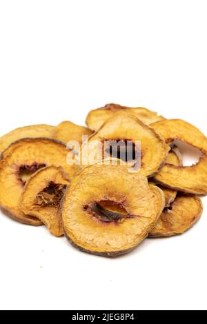 Dried peach slices. Sliced dry peach isolated on white background. Sun-dried fruit. Close up Stock Photo