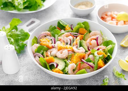 Shrimp, avocado and mango salad with fresh green lettuce. Prawn salad Stock Photo