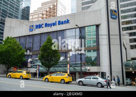 First Rbc Branch RBC Royal Bank building with cars parking on the side of the road in ...