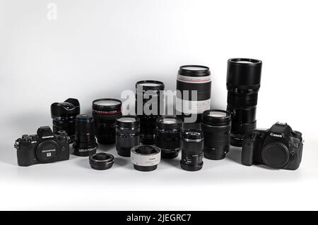 BANGKOK, THAILAND - June 27, 2022 : Photographic equipment lens and cameras isolated on white background., Illustrative editorial. Stock Photo