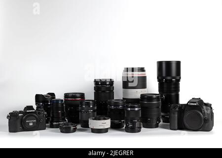 BANGKOK, THAILAND - June 27, 2022 : Photographic equipment lens and cameras isolated on white background., Illustrative editorial. Stock Photo
