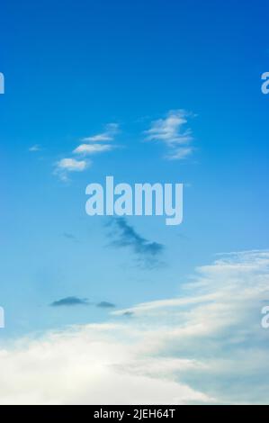 Beautiful cloudscape with abstract shapes. Clouds in the blue sky. Stock Photo