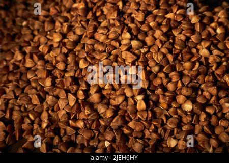 Close-up photo of buckwheat grains. Macro, texture. Stock Photo