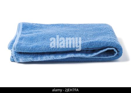 Folded blue bath terry towel isolated on white Stock Photo