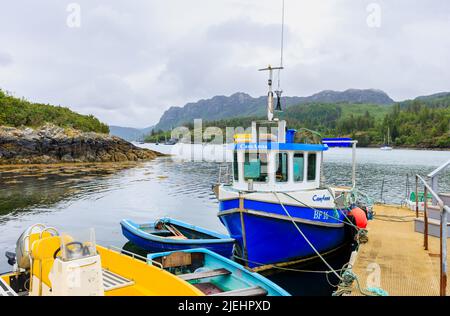 Boats moored in the harbour at Plockton, Lochalsh, Wester Ross area, a village in the Scottish Highlands on Loch Carron, setting for Hamish Macbeth Stock Photo