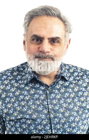 mature grey haired man in patterned shirt making silly expression portrait white background . High quality photo Stock Photo