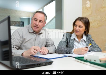 two designers having creative meeting in modern office Stock Photo