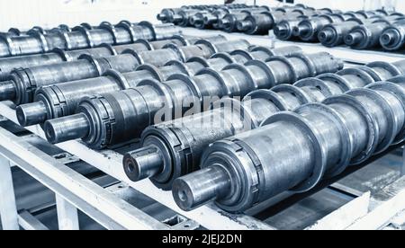 Plant for production of agricultural machinery. Metal cylindrical parts for combines or tractors. Stock Photo