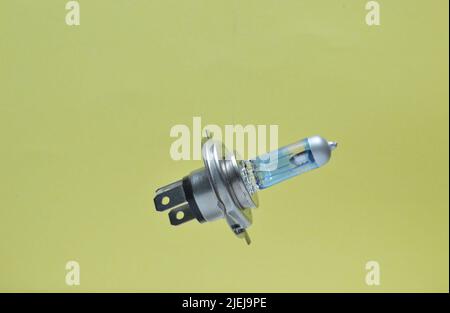 halogen car headlight isolated on orange Stock Photo