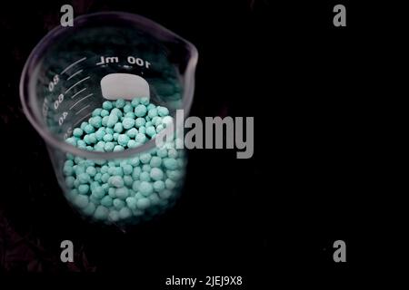 urea dangerous chemical and black background Stock Photo