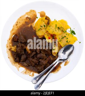 Venison ragout with port wine, thyme and mushroom aroma. Traditional dish of Toledo Stock Photo
