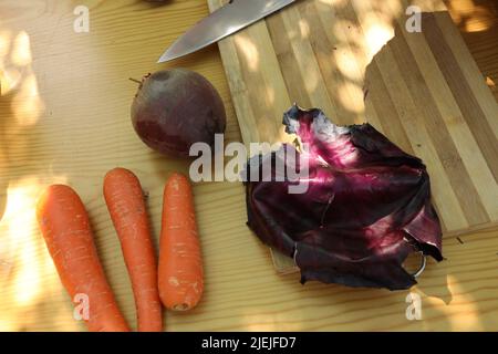 Carrot, Beetroot, Cabbage, salt on woodenboard Stock Photo
