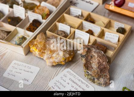 Variety of mineral speciments on counter in souvenir shop Stock Photo