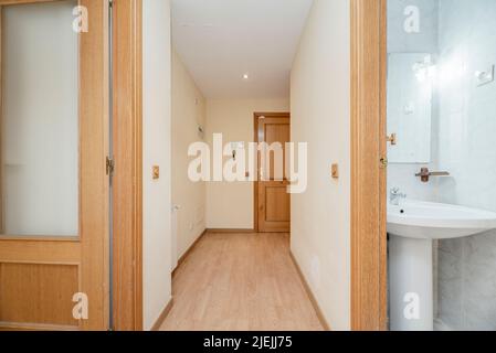 Distributor corridor of a house with access to other rooms and a small toilet Stock Photo