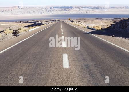 The road trought the Atacama desert, Chile. Atacama desert is a plateau in South America,strip of land of the Pacific coast, west of the Andes mountai Stock Photo