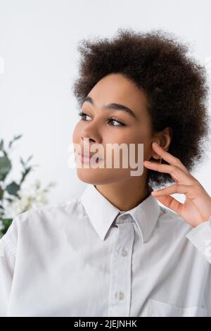 portrait of dreamy african american woman in white shirt with collar Stock Photo