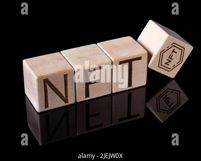 Word NFT on wood blocks as new concept of digital trading Stock Photo