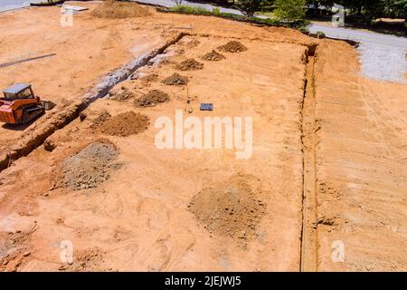 The dig trench under a concrete foundation for a new home Stock Photo