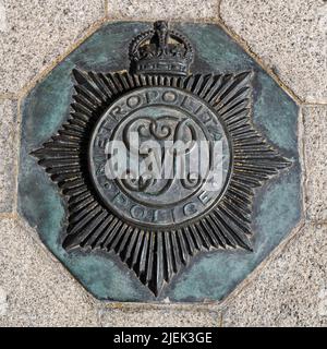 London, UK - 16th April 2022: Crown emblam for the Metropolitan Police service, embedded in the pavement outside of the New Scotland Yard building, Vi Stock Photo