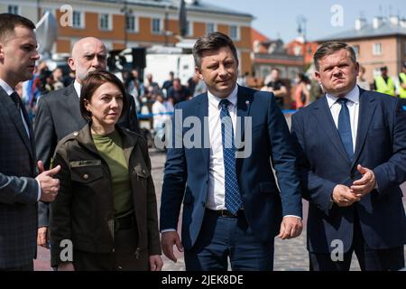 Deputy Minister of Defense of Ukraine, Hanna Maliar (L2) and Michal Dworczyk (R2), Head of the Chancellery of the Prime Minister are seen at the official opening of the exhibition in Warsaw. Polish and Ukrainian officials open an outdoor exhibition at Warsaw's Old Town of destroyed and burned out Russian tanks captured by the Ukrainians during the war. Officially named 'For our freedom and yours' the exhibition is intended to show the horror of war and Ukraineís heroic defense. It is to be later shown in other European capitals like Berlin or Paris. Stock Photo