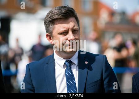 Warsaw, Poland. 27th June, 2022. Michal Dworczyk, Head of the Chancellery of the Prime Minister seen at the official opening of the exhibition in Warsaw. Polish and Ukrainian officials open an outdoor exhibition at Warsaw's Old Town of destroyed and burned out Russian tanks captured by the Ukrainians during the war. Officially named 'For our freedom and yours' the exhibition is intended to show the horror of war and Ukraineís heroic defense. It is to be later shown in other European capitals like Berlin or Paris. Credit: SOPA Images Limited/Alamy Live News Stock Photo