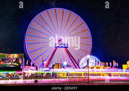 Ocean City, Maryland, USA - June 24, 2022:  View of Jolly Roger Amusement park seen from the Ocean City Maryland Boardwalk on a summer night with fun Stock Photo