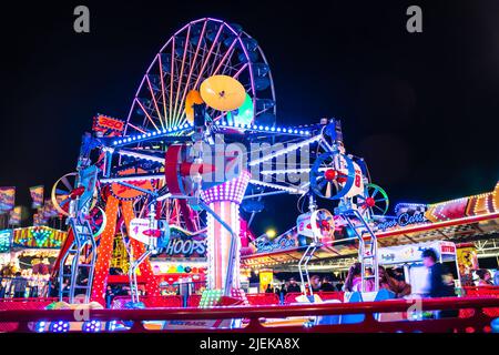 Ocean City, Maryland, USA - June 24, 2022:  View of Jolly Roger Amusement park seen from the Ocean City Maryland Boardwalk on a summer night with fun Stock Photo