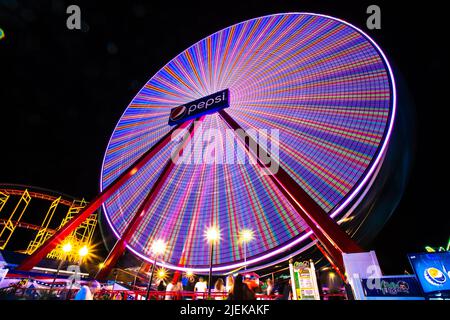 Ocean City, Maryland, USA - June 24, 2022:  View of Jolly Roger Amusement park seen from the Ocean City Maryland Boardwalk on a summer night with fun Stock Photo