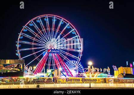 Ocean City, Maryland, USA - June 24, 2022:  View of Jolly Roger Amusement park seen from the Ocean City Maryland Boardwalk on a summer night with fun Stock Photo