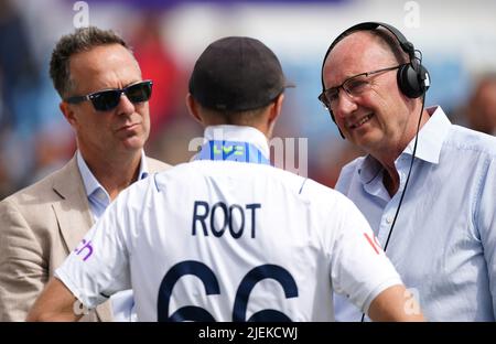 BBC commentator Jonathan Agnew (right) speaks to England's Joe Root and former England captain Michael Vaughan after day five of the third LV= Insurance Test Series Match at Emerald Headingley Stadium, Leeds. Picture date: Monday June 27, 2022. Stock Photo