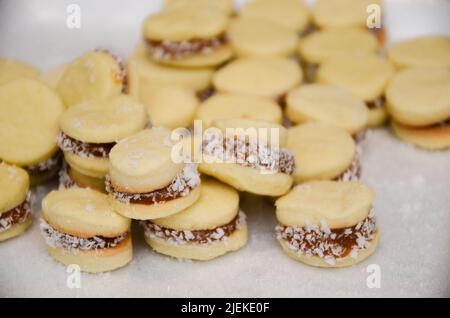 Sweet uruguayan dessert called 'alfajores', a kind of pastry, made of 'dulce de leche', kind of caramel jam, and cornstarch Stock Photo
