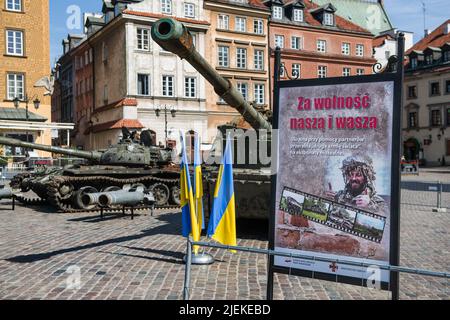 Warsaw, Poland. 27th June, 2022. Destroyed Russian tanks are seen at Warsaw's Old Town. Polish and Ukrainian officials open an outdoor exhibition at Warsaw's Old Town of destroyed and burned out Russian tanks captured by the Ukrainians during the war. Officially named 'For our freedom and yours' the exhibition is intended to show the horror of war and Ukraineís heroic defense. It is to be later shown in other European capitals like Berlin or Paris. (Photo by Attila Husejnow/SOPA Images/Sipa USA) Credit: Sipa USA/Alamy Live News Stock Photo