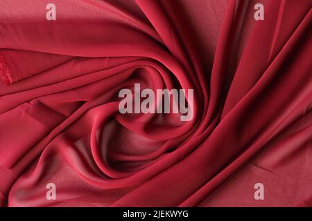 Luxurious red burgundy viscose or silk fabric Stock Photo
