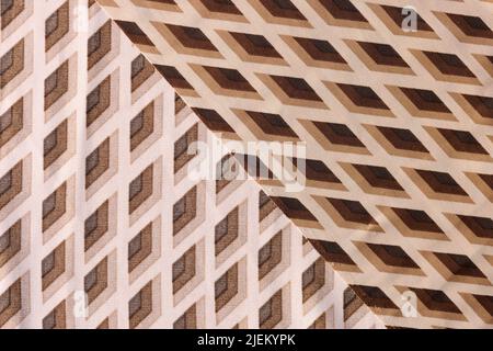 Fabric is cotton beige brown in rhombuses closeup Stock Photo