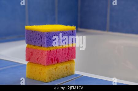 Colored bright sponges in the bathroom. Accessory for house cleaning. Clean house. Cleaning concept Stock Photo