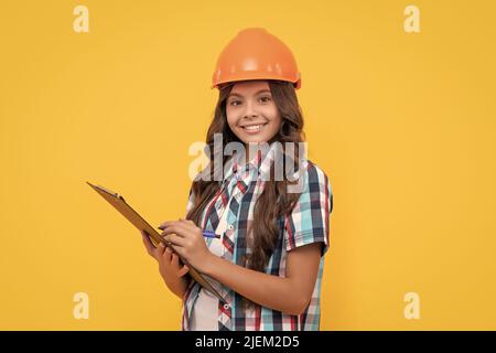 signing a contract. on construction site. future engineer hold clipboard. safety work expertise Stock Photo