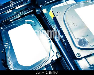 A pile of old hard drives Stock Photo