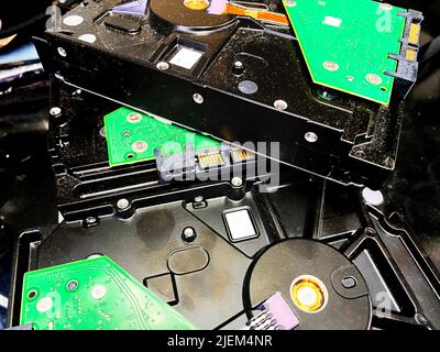 A pile of old hard drives Stock Photo