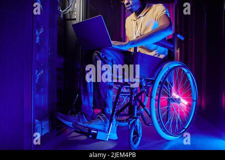Cropped shot of person with disability working at system administrator in server room, copy space Stock Photo