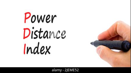 PDI power distance index symbol. Concept words PDI power distance index on white paper on a beautiful white background. Businessman hand. Business PDI Stock Photo