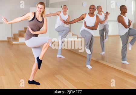 Adult people training dance movements in choreography class Stock Photo