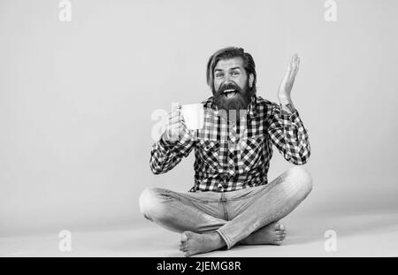 surprise. need some coffee for inspiration. perfect start of the day. happy bearded man drinking morning coffee. man drink hot tea from cup. good Stock Photo