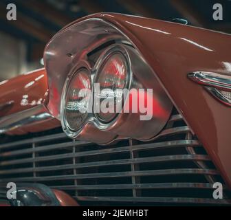 Headlight lamp vintage classic car, close-up of a round headlight Stock Photo