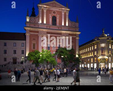 Slovenia, Ljubljana, Franciscan Church, Presernov Trg, people, night, Stock Photo