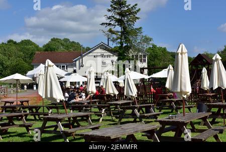 Some of outdoor seating area of The Riverside Inn and restaurant by River Avon, Saltford, UK Stock Photo