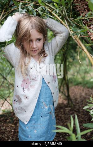 Girl, aged 5, playing in the park Stock Photo