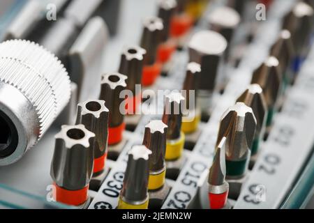 A set of metal bits for screwdrivers in a box. Hexagon head of different sizes Stock Photo