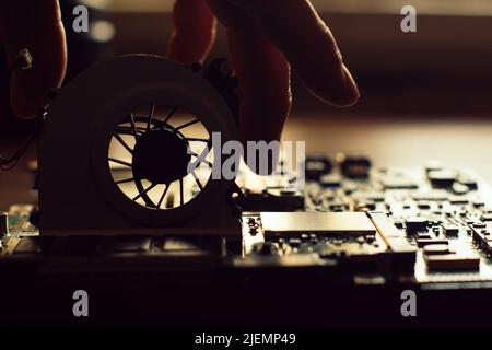 Technician repairing a broken computer Stock Photo